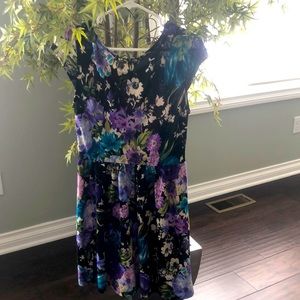 This is a mini dress by one clothing.The colors are blue,purple,white,and green